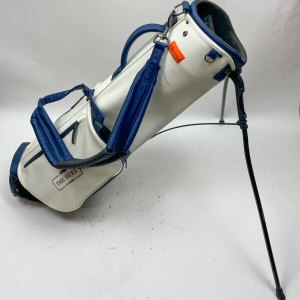 Vintage retro golf bag with old fashioned well-worn golf clubs